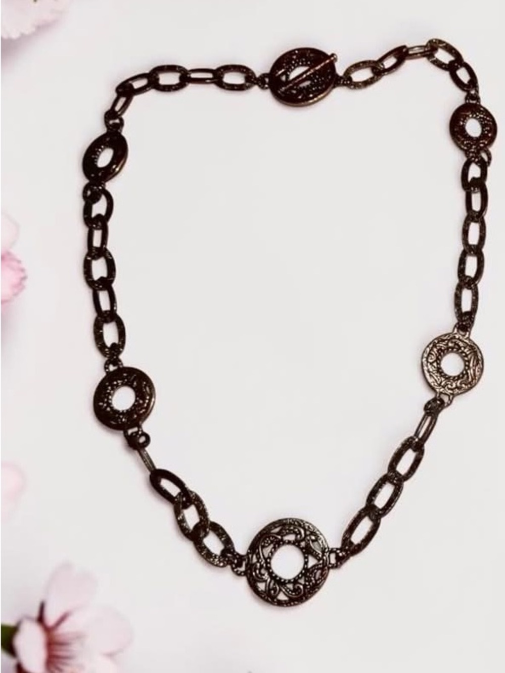 Carolyn Pollack features intricate, openwork circular links crafted from SS